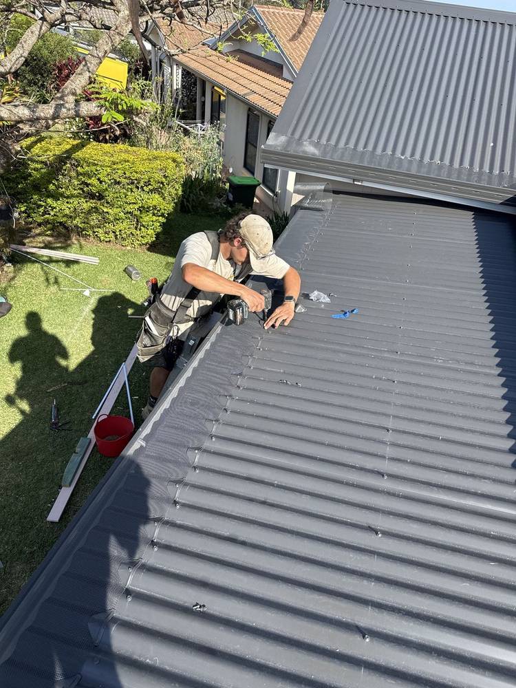 Old roof sheets being replaced