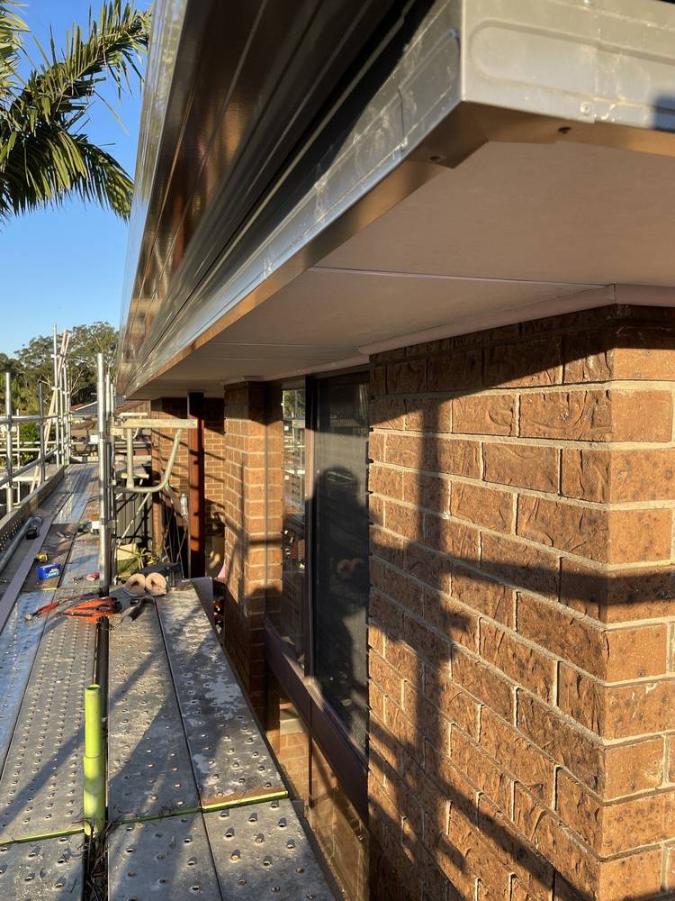 New eaves, fascia and gutter on a brick home