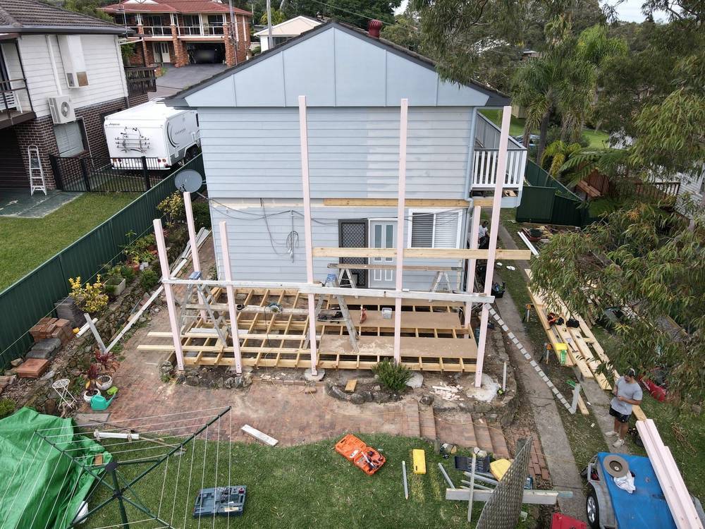 New floor and wall frame going up under a house