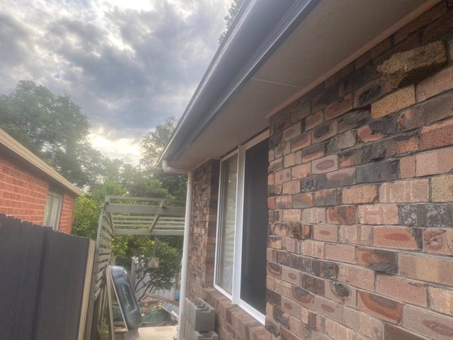New gutter and fascia on a brick house