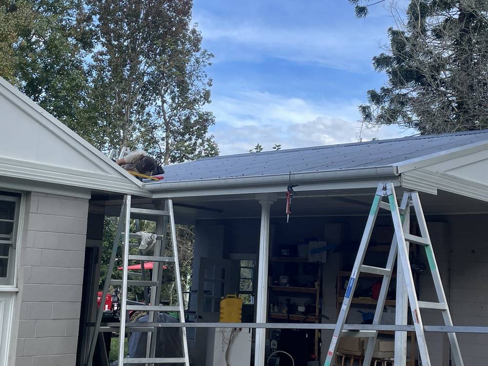 New roof sheets going on with the ladders up